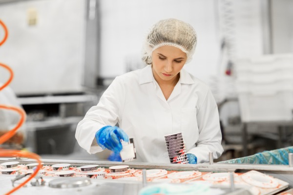 assembly line employee developing kits