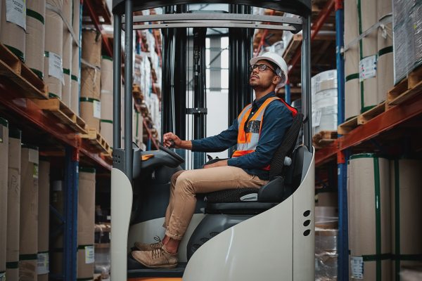 warehouse worker driving a forklift