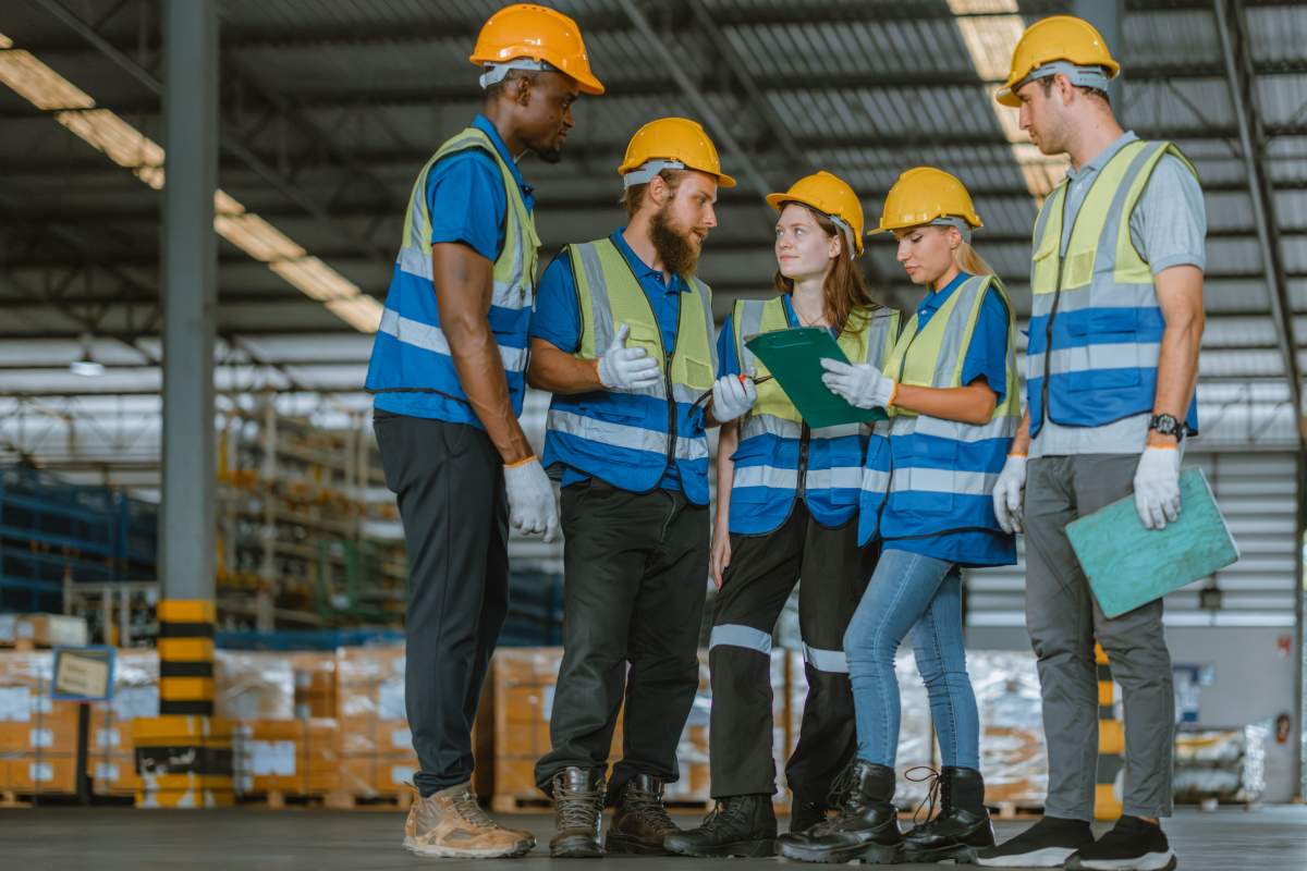 warehouse team members meeting with the warehouse manager
